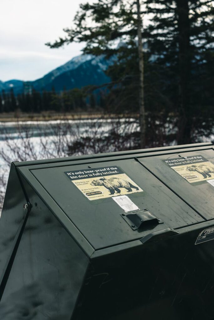 Bear-proof trash container in snowy Canadian landscape, safeguarding nature.